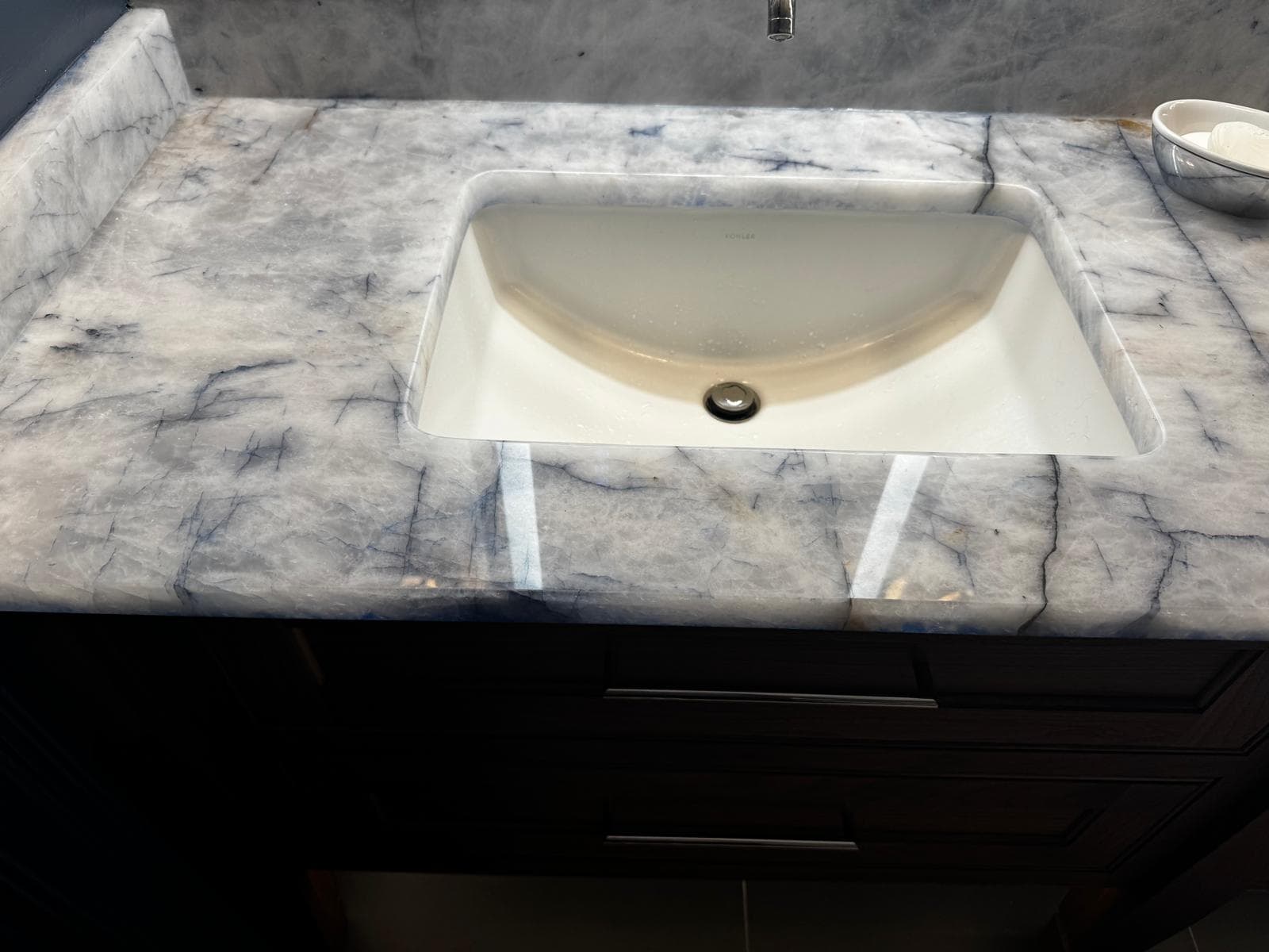 Undermount sink detail in blue quartzite bathroom countertop, Atlanta, GA