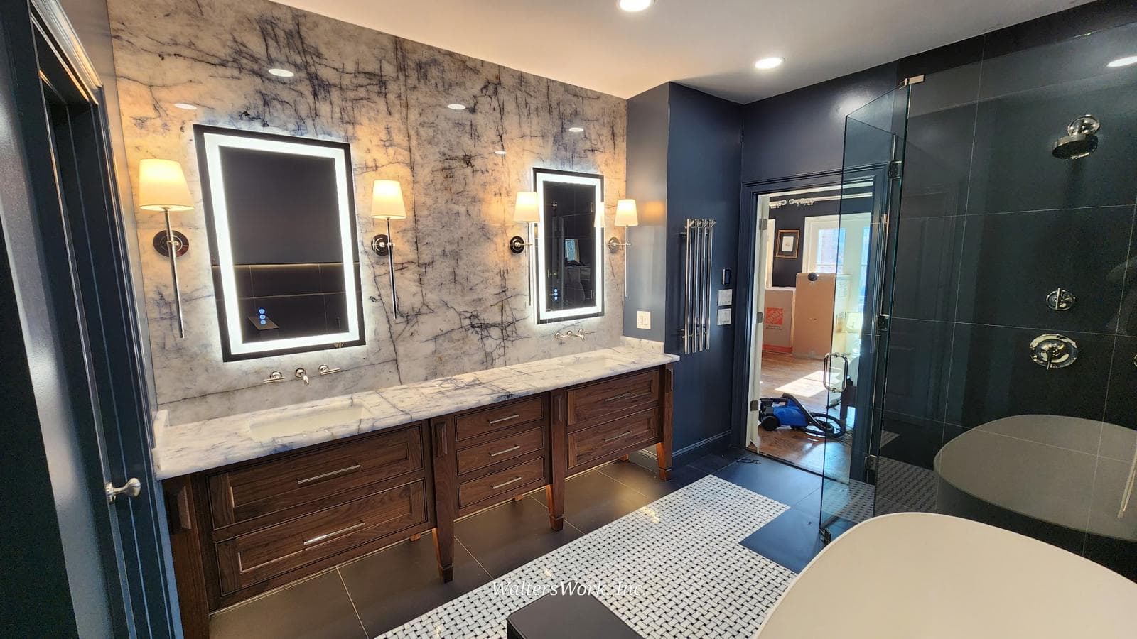 Freestanding soaking tub and glass shower beside walnut vanity, Atlanta, GA