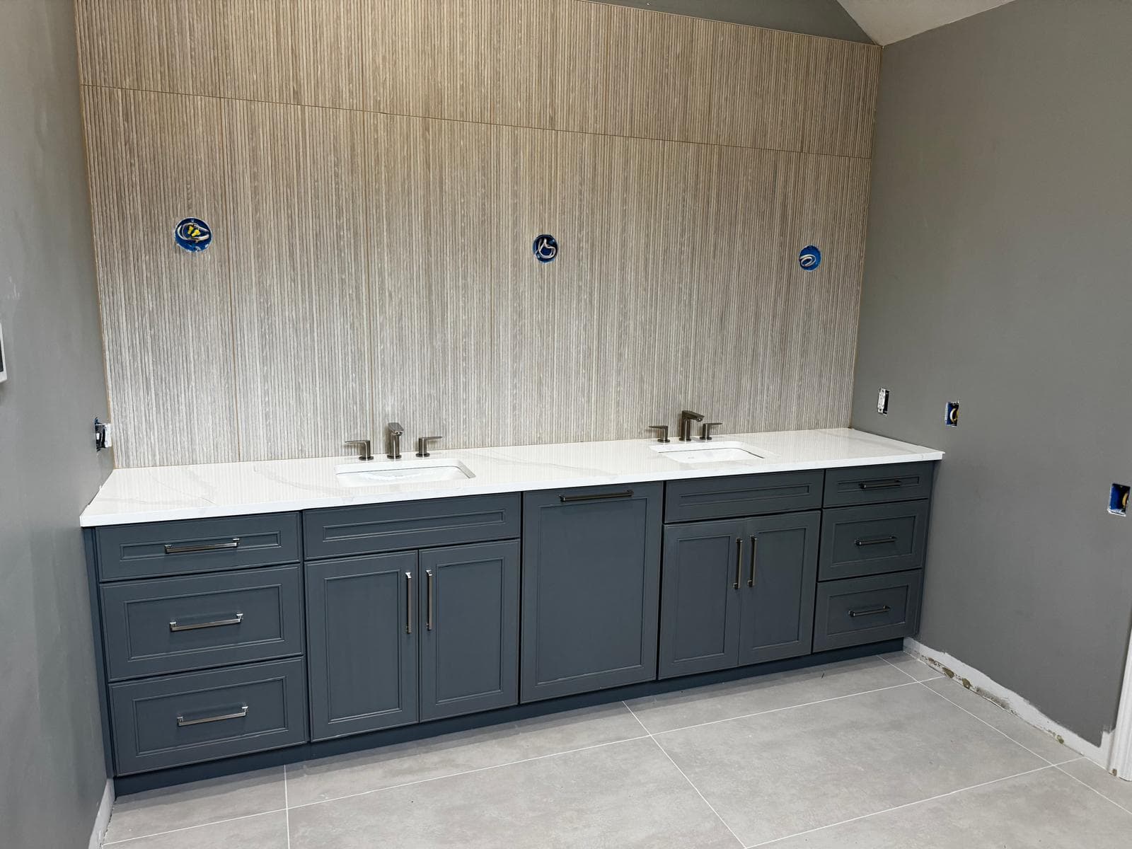 Gray double vanity with quartz countertop and wood-look wall tile, Atlanta, GA