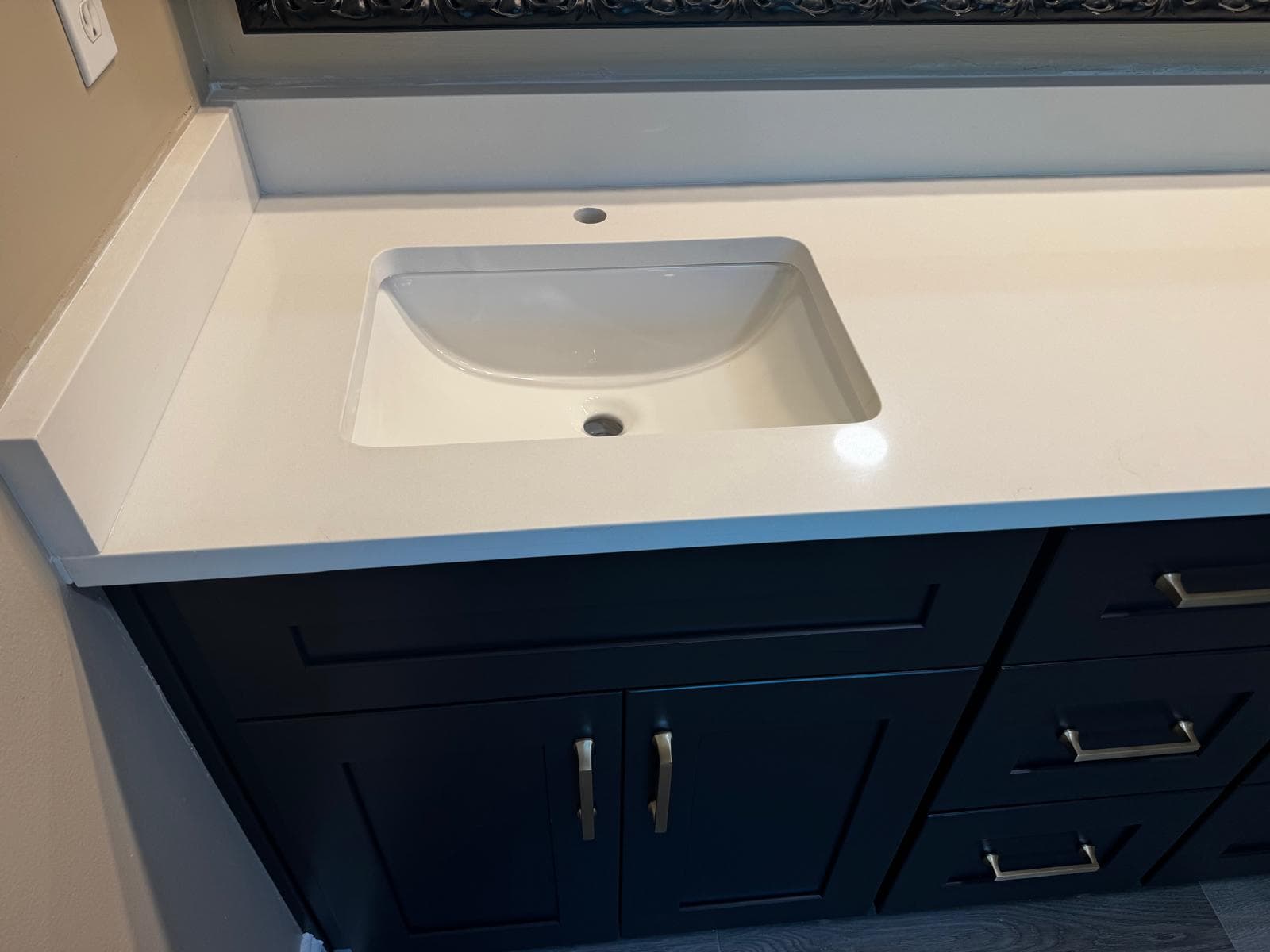 Undermount sink detail in white quartz bathroom vanity countertop, Atlanta, GA