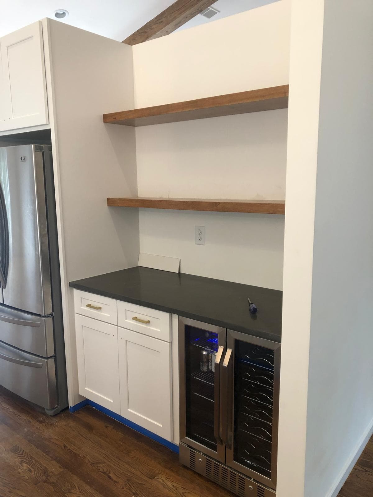 Built-in cabinetry with floating wood shelves and dual-zone wine fridge, Atlanta, GA