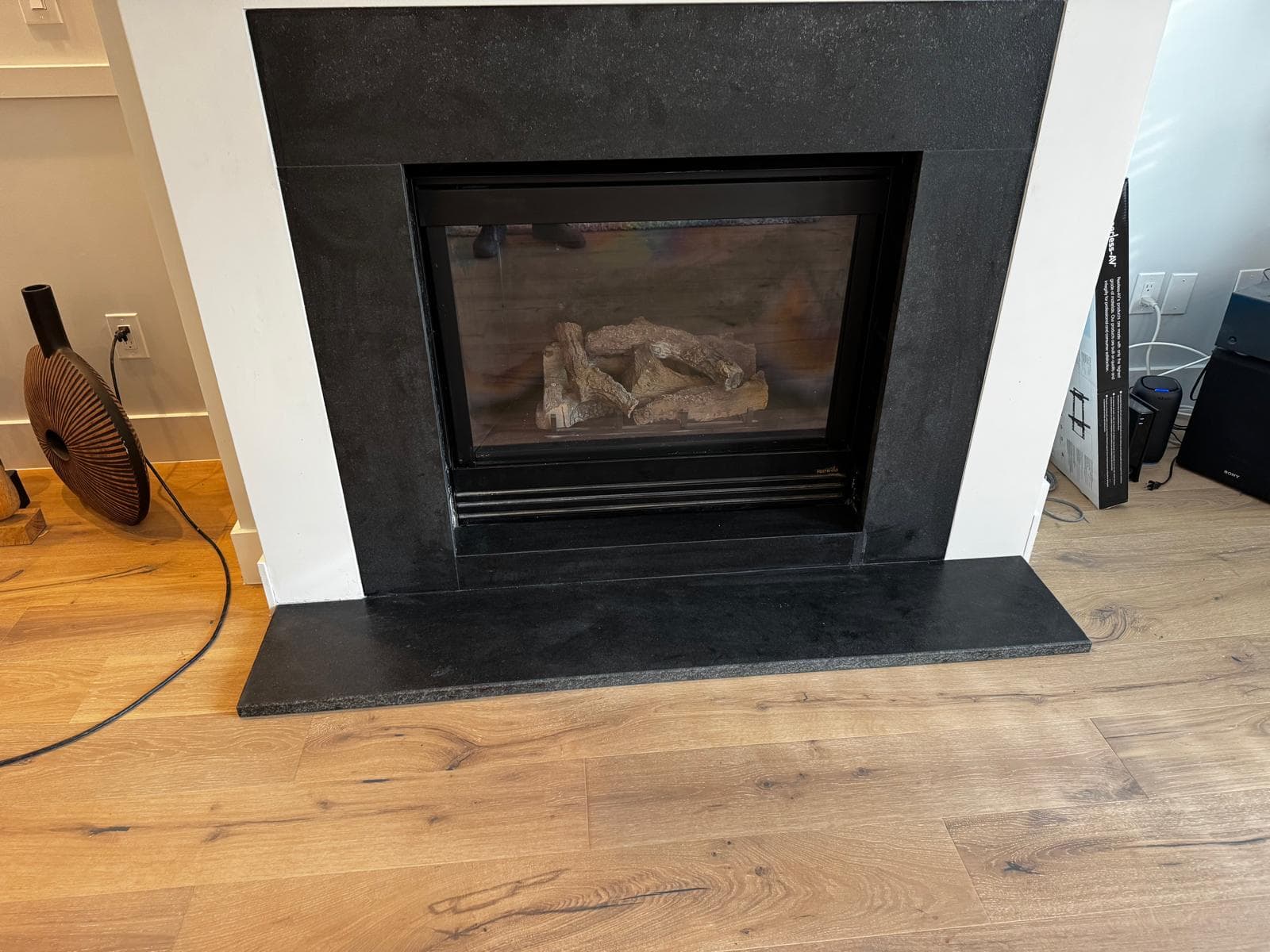 Black granite fireplace surround and hearth with white mantle, Atlanta, GA