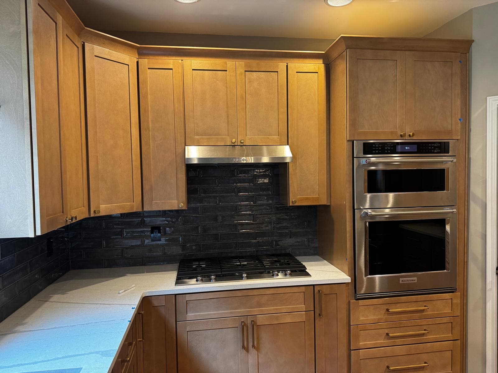 Honey oak cabinets with stainless double wall oven and gas cooktop, Atlanta, GA