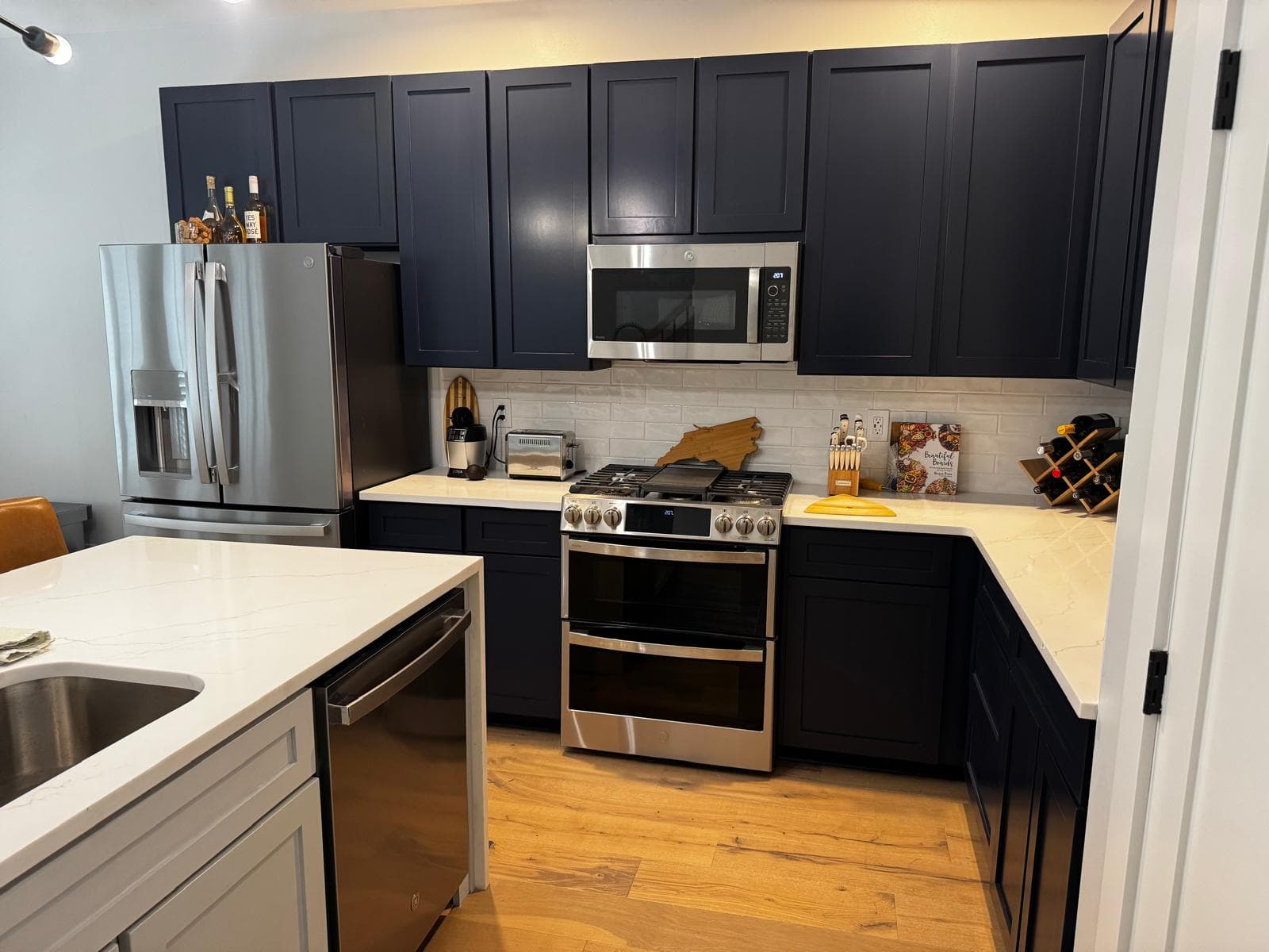 Stainless steel undermount sink set in white quartz island countertop, Atlanta, GA